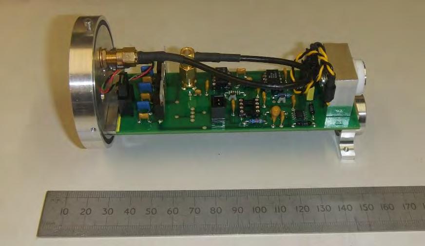 The lens/antenna assembly is supported by a bracket attached to one end of the circuit board: Fig. 3.