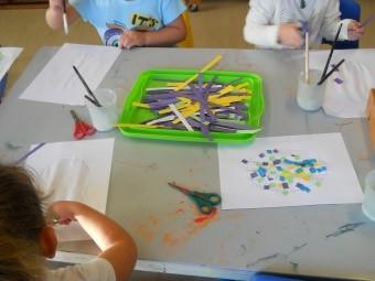 The children draw patterns on the frame using pastels or wax crayons.