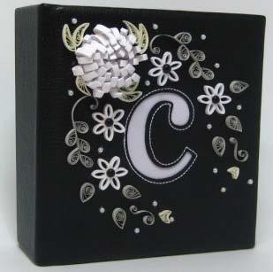 I used the cream quilling strips in the kit for the three flowers and used the white pearls for their centers.