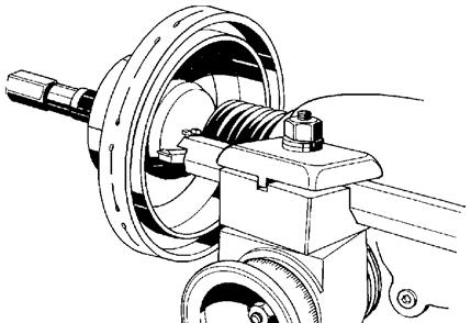 5. Position the boring bar by loosening the boring bar clamp nut and sliding the boring bar inward toward the drum until the tool bit is close to the drum.