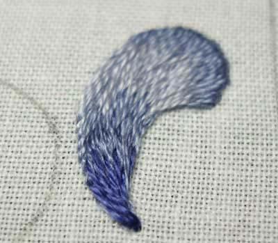 Keep gradually moving your stitches around the bend of the swash, adjusting the stitch direction as you go.