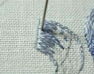 Working in light blue (159), work the long and short stitch over the split stitch line at the top end of the