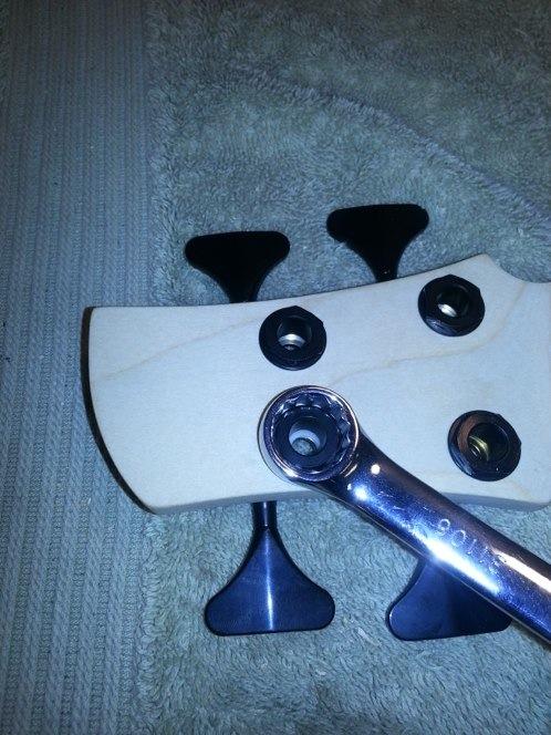 39. Tighten the tuner nuts with a 5/8th (16