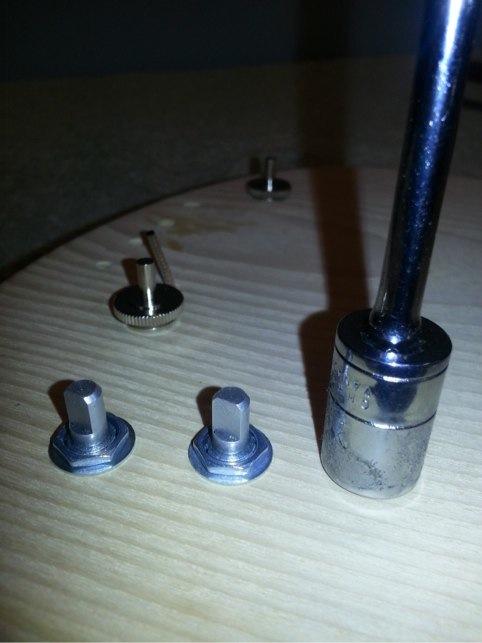 Tighten the washers and nuts to the posts with a 7/16th (11 mm)