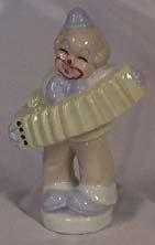 75 Item # 225 Clown holding accordion. Made in Italy.