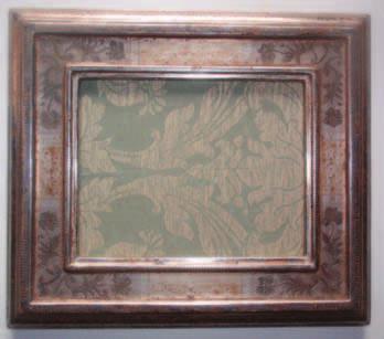 Rusticated Military Trophy Frame, with spandrel, walnut 1880, 8½ x 6½ x 3 inches. This frame originally housed a mezzotint engraving of Robert E.
