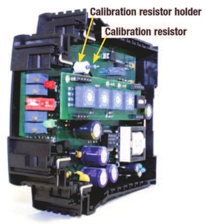 The calibration resistor can be changed in the field if required by following the procedure below. 1. Remove all power from the APD4059, unplug all connectors, and remove unit from DIN rail. 2.