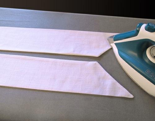 Clip the corners and press open the seam allowances. 8. Turn each sewn tie right side out.