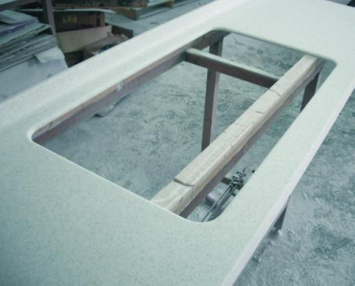 Position the sink into the cutout so that the flange rests on the deck.