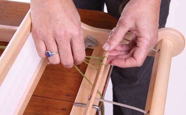 Take the yarn UNDER the back warp stick and make another loop and pull through