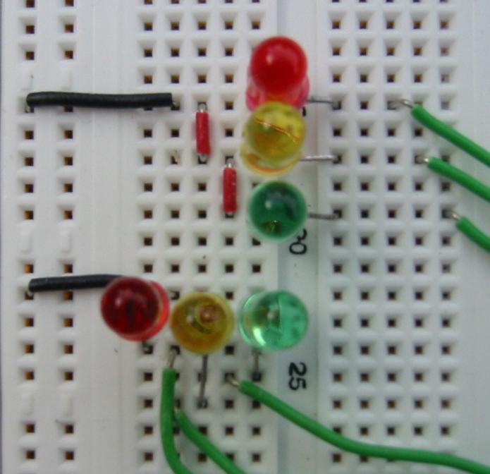 1. Install two each of red, yellow, and green LEDs on the NI ELVIS II protoboard, positioned as a two-way stoplight intersection. Figure 7.5.