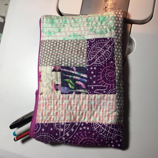 To finish the pencil case, unzip the zipper and now fold the wadding pieces right sides together and pin them.