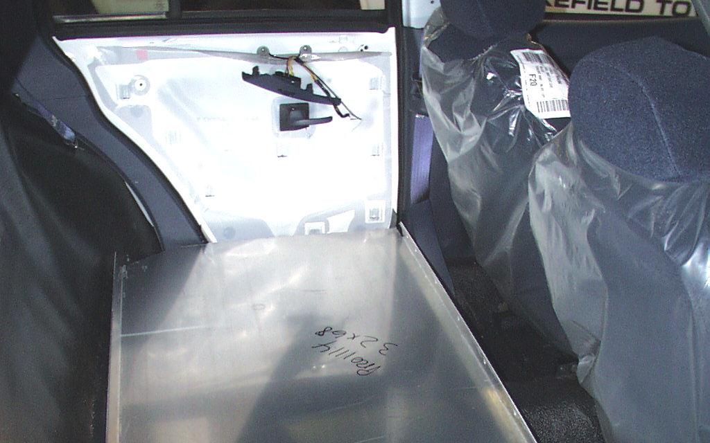 INSTALLATION: 1. Remove necessary interior trim parts: Remove rear seat (bottom and back) Remove OEM door panels.