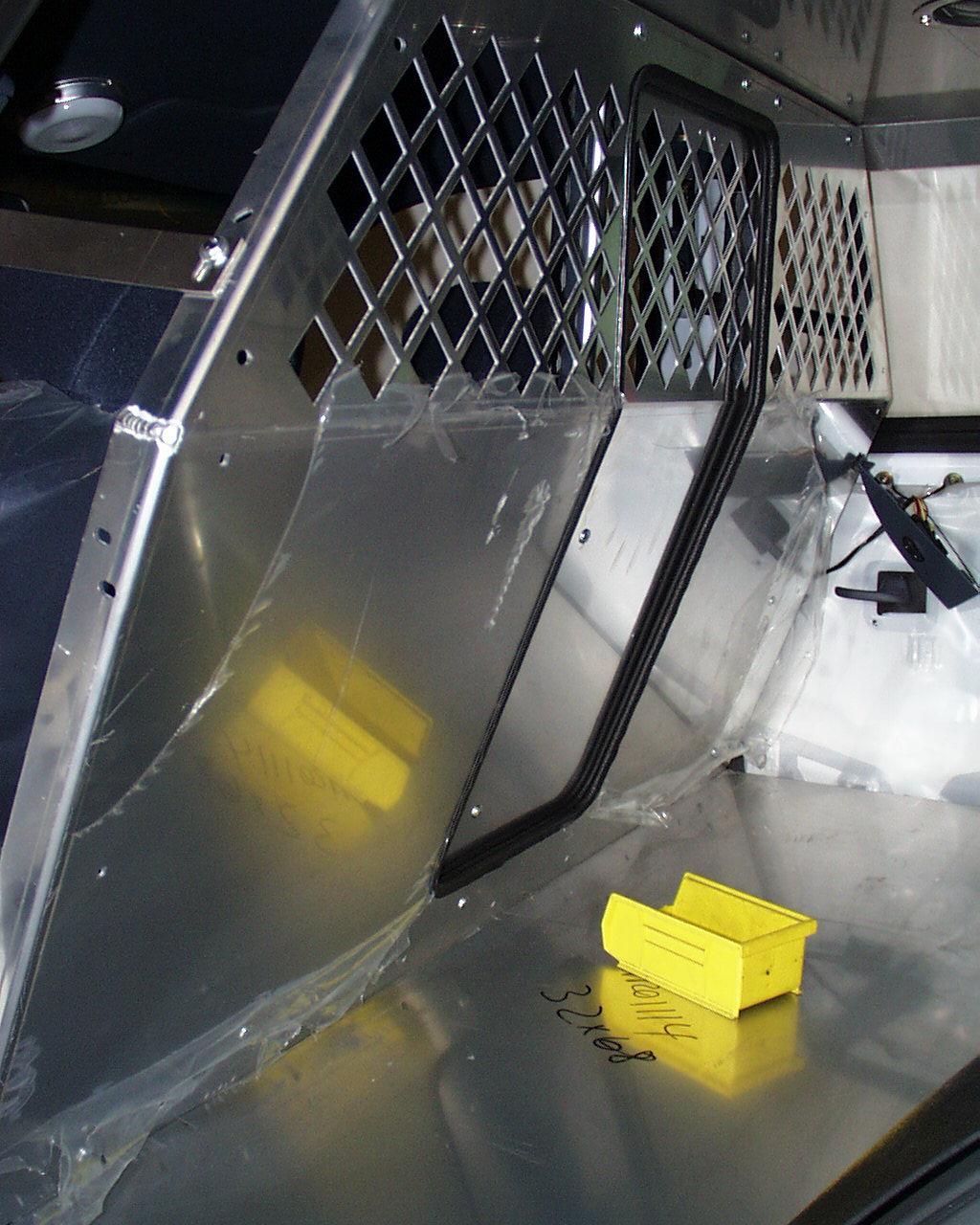 Use #10 x ¾ Stainless Sheet Metal Screws and attach bottom of rear cage to floor. Use 5/32 pilot hole. (See Photo 3) 4.