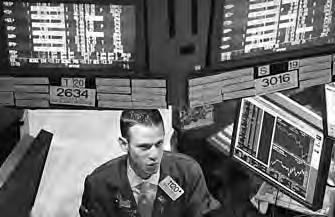 BUSINESS 42 A trader works on the floor of the New York Stock Exchange in late afternoon trading on Aug 3 in New York City.