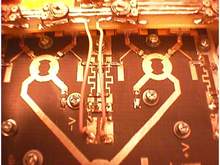 Port-Port Isolation of the couplers/splitters is excellent and as such small 1206 50 ohm chip resistors were found to be satisfactory loads On the main output combiner several chip resistors were