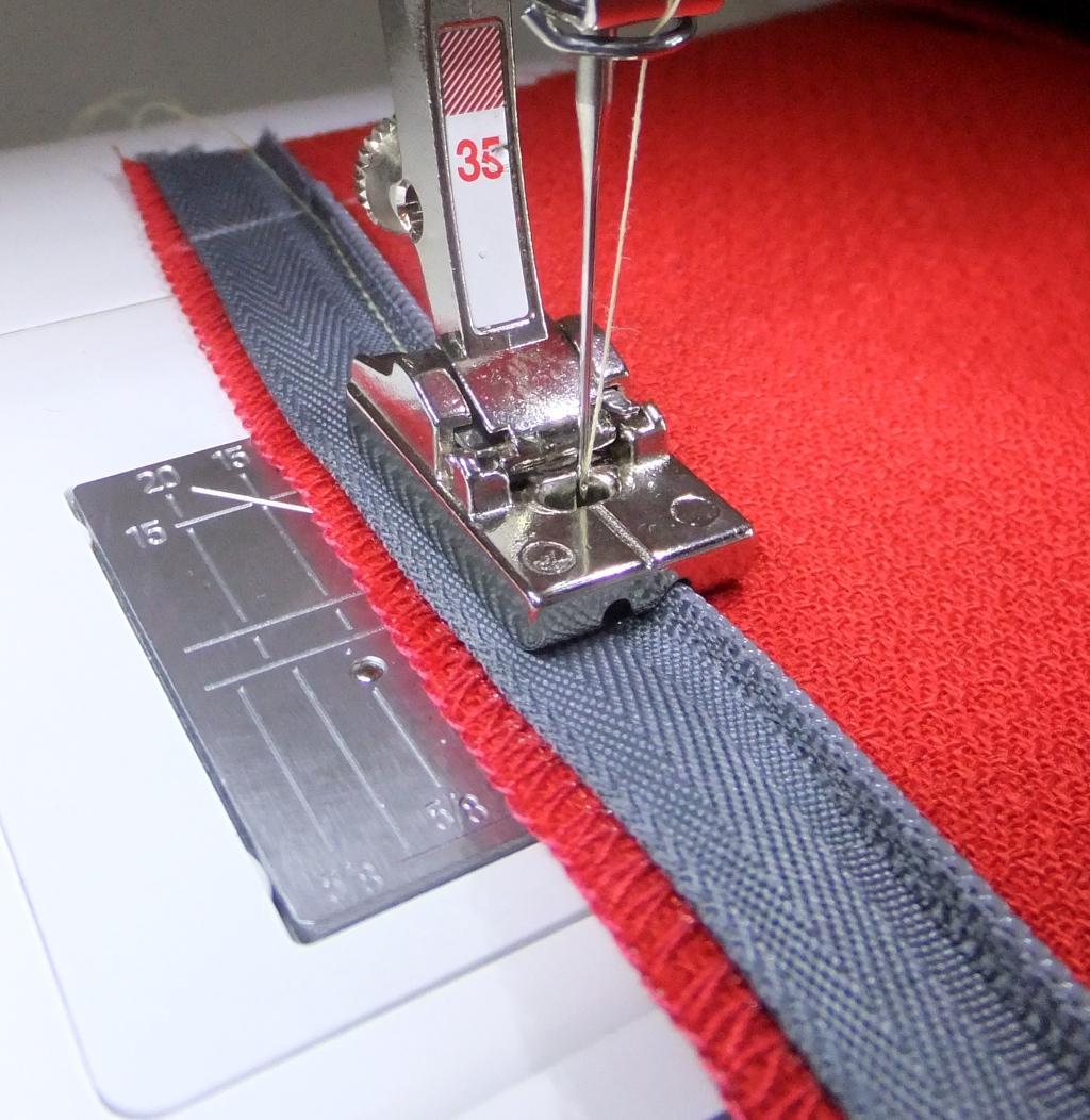 Sew the Zipper Tape Using an invisible zipper foot, position the right groove of the foot over the coil and stitch until either the foot touches the slider or to the length of the zipper opening as