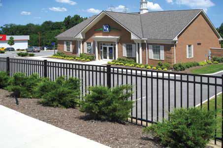 The ForeRunner rail allows this aluminum fence system to follow changes in elevation while maintaining security under the fence.