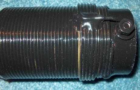 The coil form is made from a length of 2" OD PVC pipe. I cut each coil form about 3/4" longer on each end than the spacing between the mounting bolts.