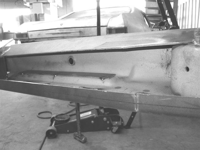 38. Prepare to install forward top plate on passenger side. The forward part of the frame rail is not a consistent height from the factory.