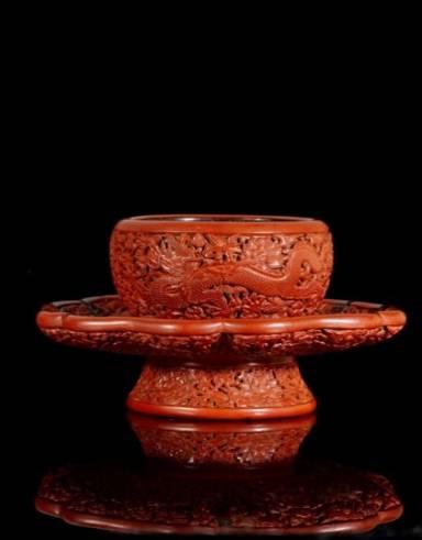 An Exceptional Early Ming Cinnabar Lacquer Dragon Bowl Stand Incised Mark and Period of Yongle Estimate: te: HK$20 30 million / US$2.56m - 3.85 million Height: 16cm.
