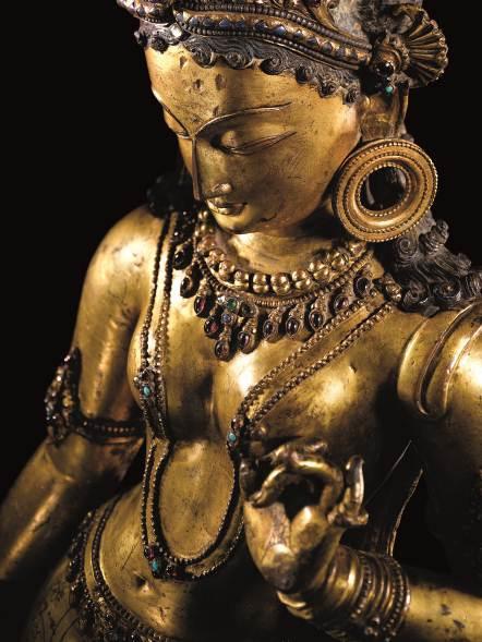 A Sublime Large Gilt-Copper Figure of Tara Nepalese, 13th Century Estimate Upon Request Height: 72 cm.