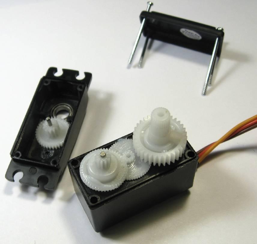 For those wanting a continuous rotation servo, there are many servos out there that are easier to hack, but I will provide some (untested) hints on how to do it.