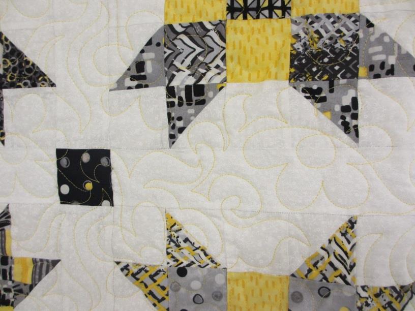 yellows, white, black, and gray in fabric