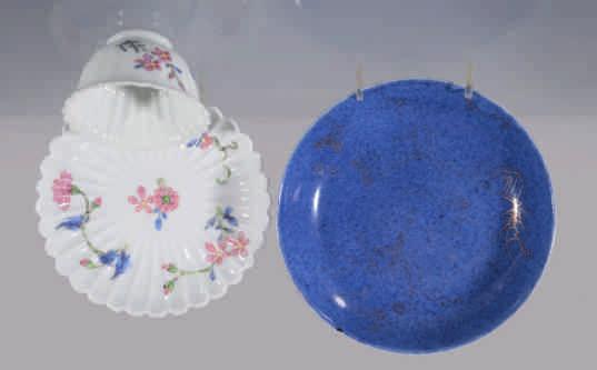 Derbyshire 26. A Chinese fluted famille rose tea bowl and saucer, painted with sprigs of flowers, Yongzheng 27.