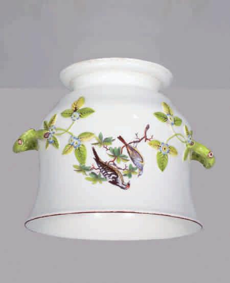 75. A rare Chelsea bottle cooler, of waisted form, with flared rim, finely painted in coloured enamels with naturalistic birds on branches, the two pale green glazed twig loop handles with applied