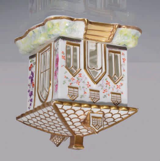 152. An unusual English porcelain large pastille burner and cover, in the form of a square cottage, with tiled roof with two dormer windows and a chimney, and