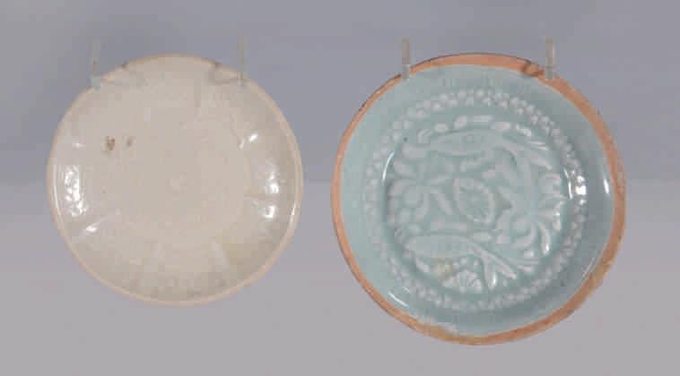 7. A Chinese Ding type moulded small dish, with central dragon motif bordered with partitioned floral panels, 3 5 /8" diameter, Northern Song/Jin Dynasty, 12th-13th