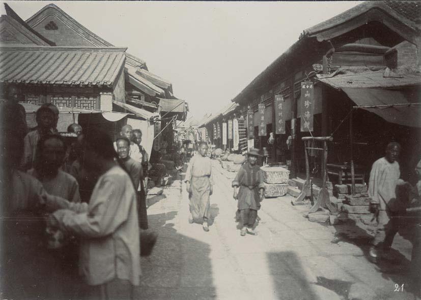 192 TSINANFU. Road in Tsinanfu with shops. ca. 1900.