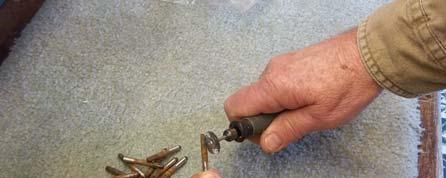 I use an electric flexible shaft rotary tool with a fine wire brush to clean the tuning pins.