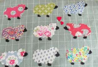 Make up your cushion cover: Peel the backing paper off the Bondaweb and arrange your sheep.