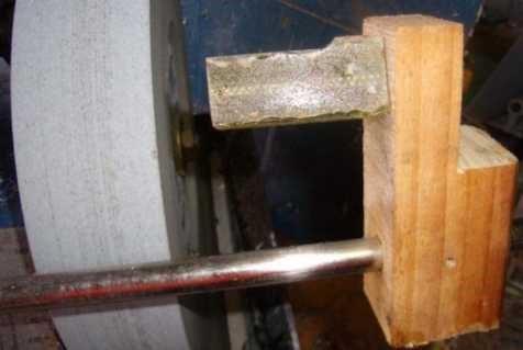 I use a simple timber block with a hole to slide it on the wet