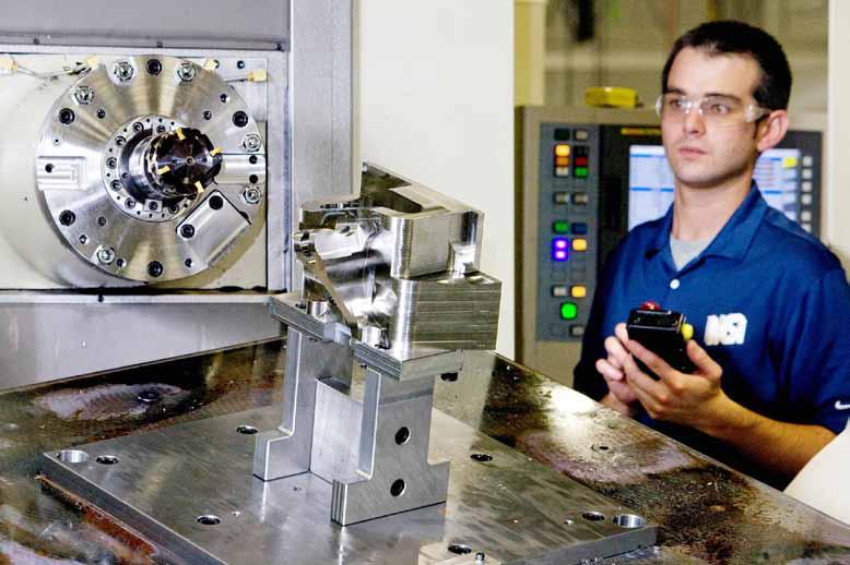Tripp Cook, Machine Specialties Inc., monitors finishing operations performed on a Ti 10-2-3 workpiece.