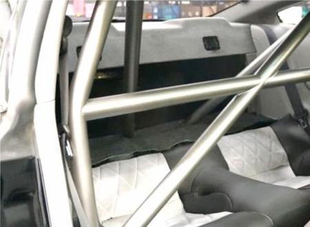23) Fit Roll Bar s two diagonal tubes to the main hoop. Install two provided bolts into each diagonal tube s machined joint and snug into place. Start all 4 bolts in each rear foot next.