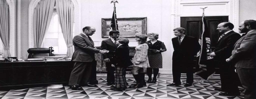 Swearing in ceremony at the Office of Management and Budget. This photo was taken after swearing in, while Ford was Vice President, Feb. 6, 1974.