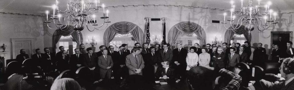President Nixon signing the budget in cabinet room, 1974.