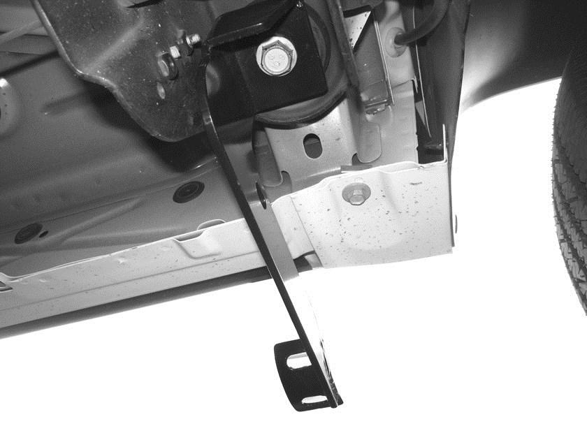 Start the installation under the driver side of the vehicle and remove the front, center, and rear body mount bolts. Do not remove bushings. 3.