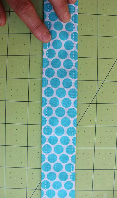 Press with iron. Topstitch. Sew Pad - All Pieces Together Step 18.