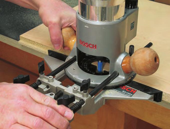 Photo 1: Get started by routing the 1/4" x 1/2"-deep rabbets in the sides (pieces ) to accept the back (piece 5).