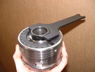 an anti-clockwise direction Using 11/2" Spanner to remover chuck from lathe With the chuck in your hand and using