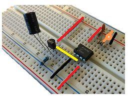 Step 5: Insert other orange capacitor This (orange item) is a 0.1 µf (microfarad) capacitor.