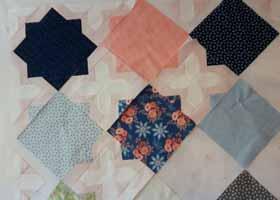 Here are the first few rows of my quilt. I pressed towards the LC squares when sewing my units into rows. You may press your sewn rows in any direction.