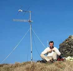 RADCOM MAY 2010 GHz BANDS PHOTO 2: Ross, G6GVI, operating portable on 23cm and 4m from Winter Hill.