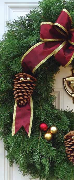 The Balsam Fir Classic Wreath is tastefully decorated with a long tailed, gold-backed velveteen bow and white tipped and glittered