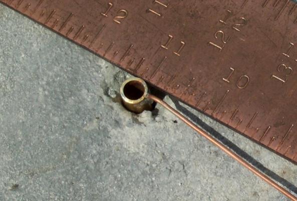 can t get it vertical, you may have to drill out the hole in the concrete a bit. Slowly add sand to the center hole so that the bearing extends from the top of the hole about 1/16.