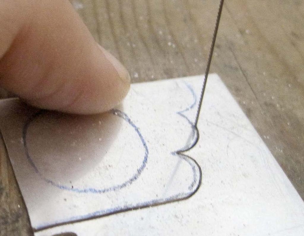 Sterling silver and acrylic components Cut the sterling silver sheet. Trace Template 1 onto tracing paper. Use carbon paper to transfer the design onto a 13/8 x 1 3/16 in.